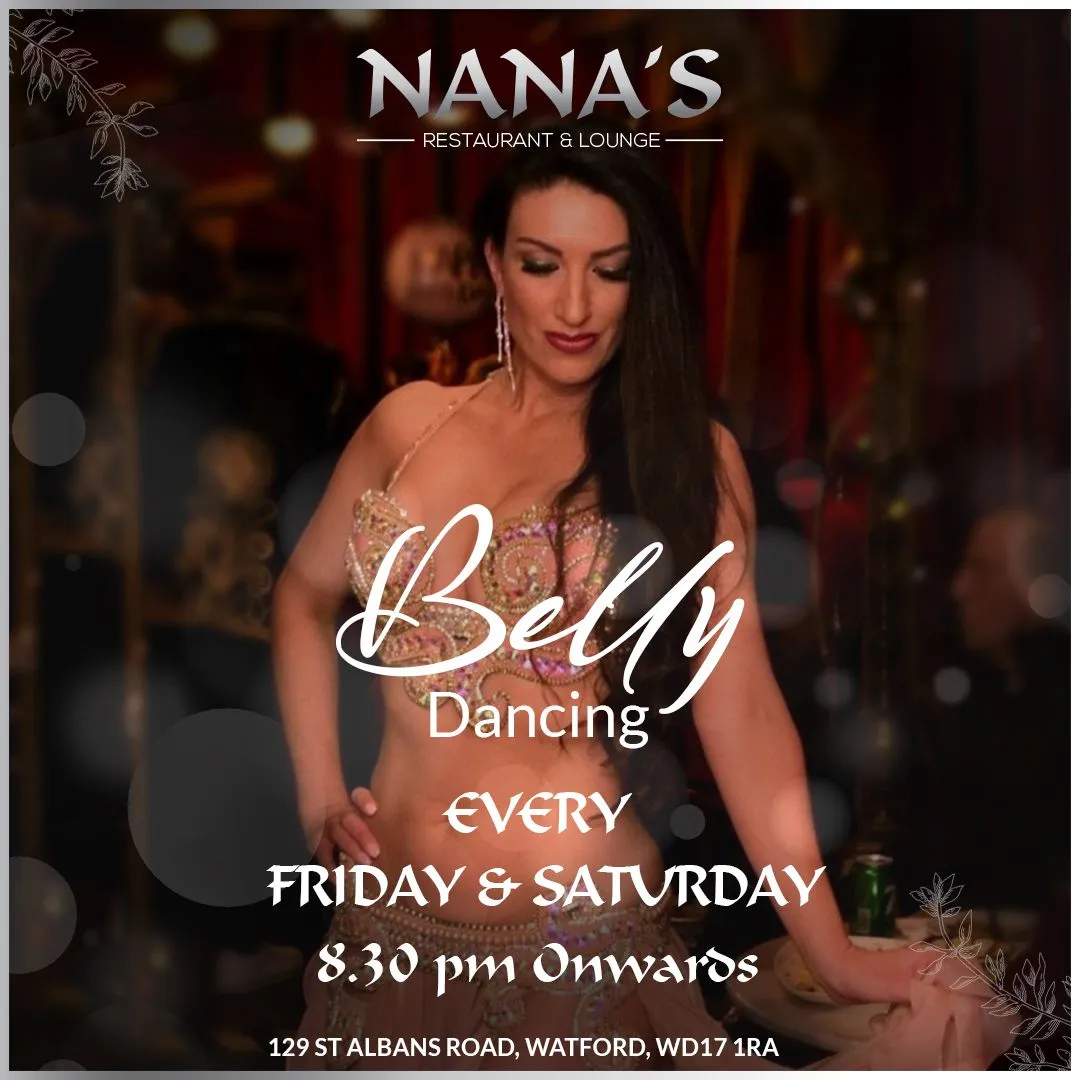 A belly dancer performing between the tables at Nana's